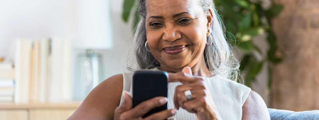 elderly woman chats with healthcare professional on smart phone